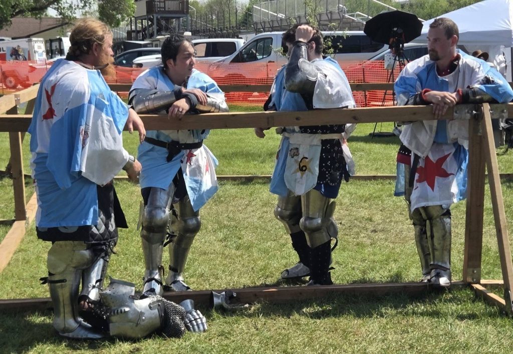 Fighters resting on the list rail between rounds